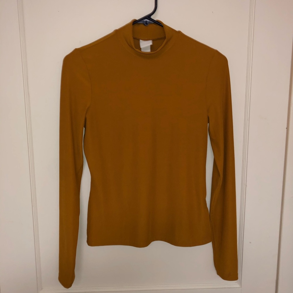 Mustard yellow mock turtleneck.
